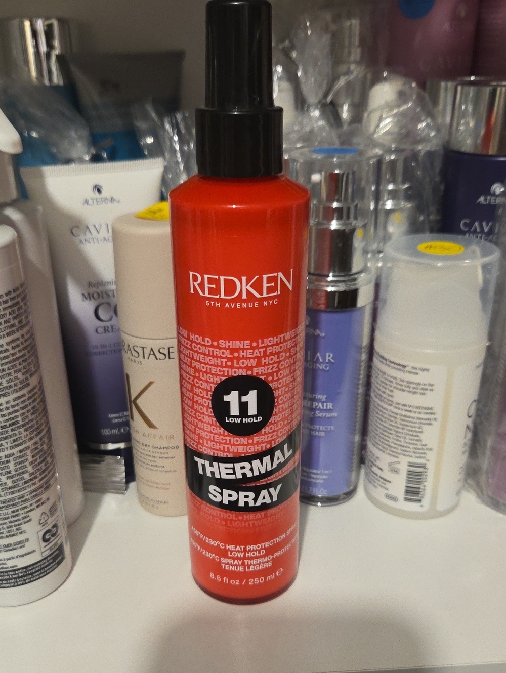 Redken Thermal Spray 11 in Bright Red and Black Bottle